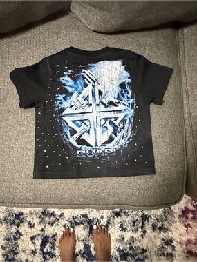 Black Kids Short-Sleeve Graphic Tee with Blue Metallic Accents and Black Jeans
